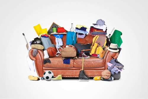 Flat clearance team removing furniture in Forest Hill flat